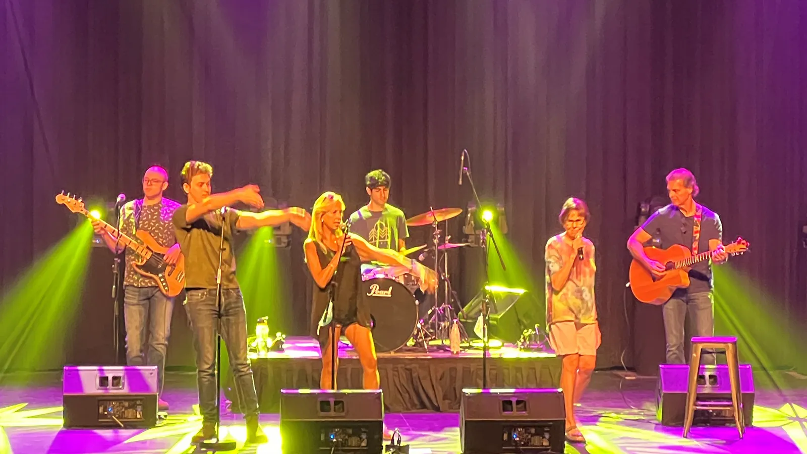 Sharon & Randi performing on stage with band